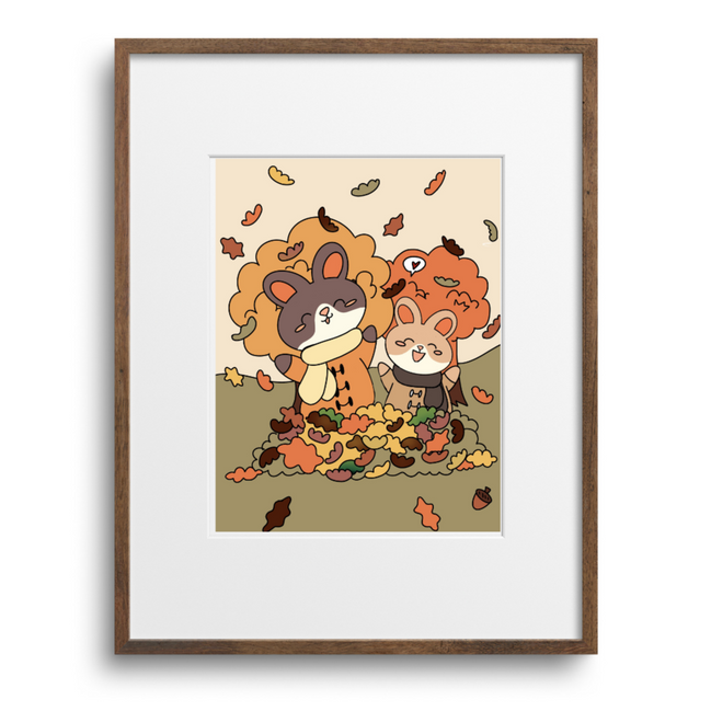 Framed artwork of two cartoon bunnies with autumn leaves on a beige background