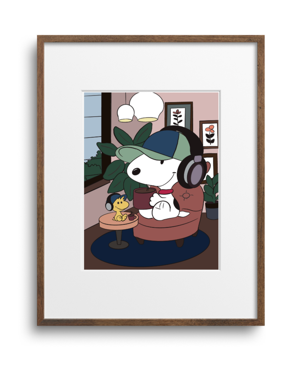 Framed artwork of a cartoon character sitting in a room with headphones on