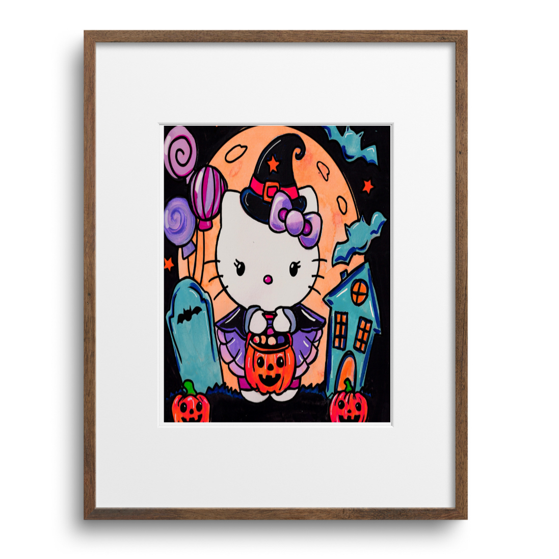 Framed artwork of a cartoon cat in a Halloween-themed setting on a white background