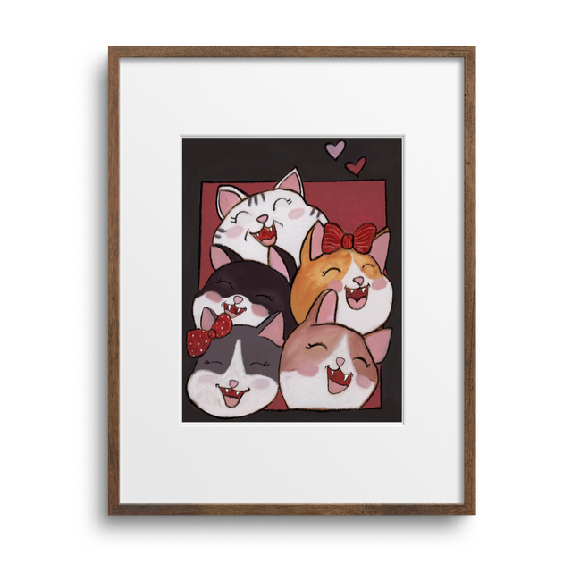 Framed artwork of cartoon cats on a white background