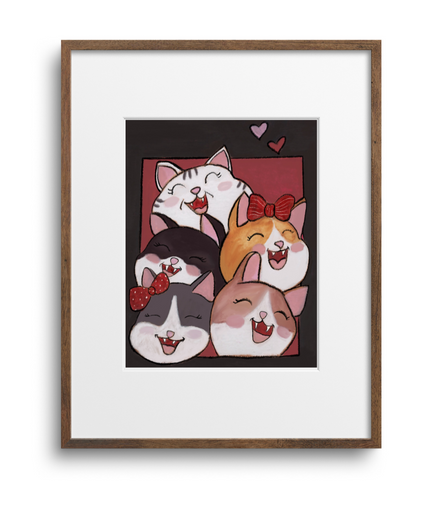 Framed artwork of cartoon cats on a white background