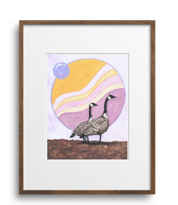 Framed artwork of two birds on a hill with a colorful sky.